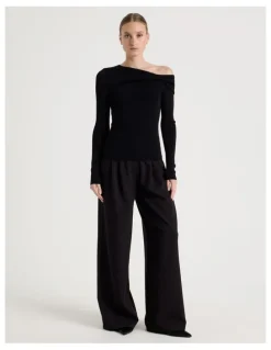 Blaq Asymmetrical Off The Shoulder Knit Top in Black