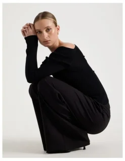Blaq Asymmetrical Off The Shoulder Knit Top in Black