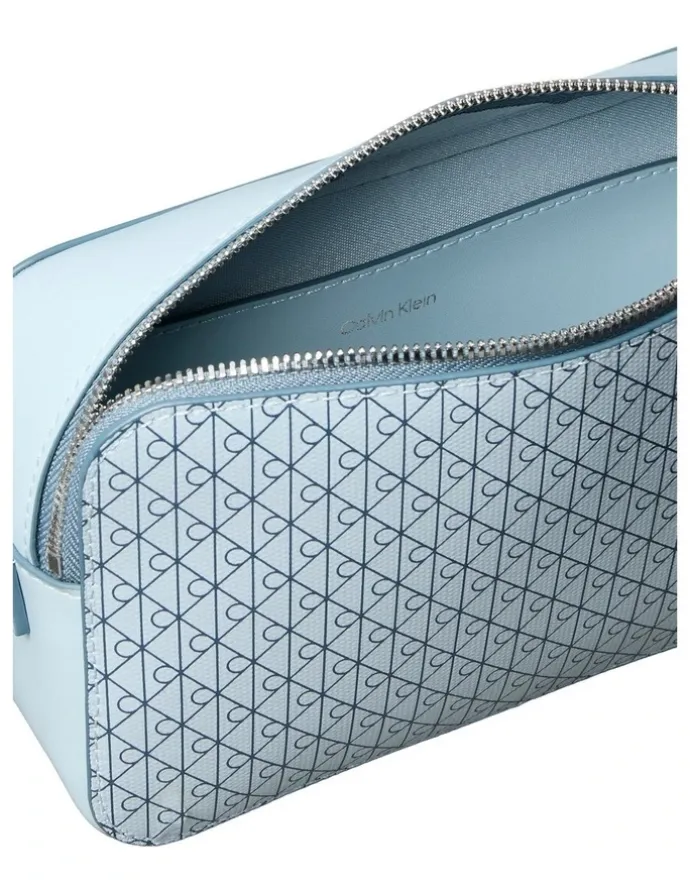 Calvin Klein Emblem Allover Print Crossbody Bag in Palest Blue AOP