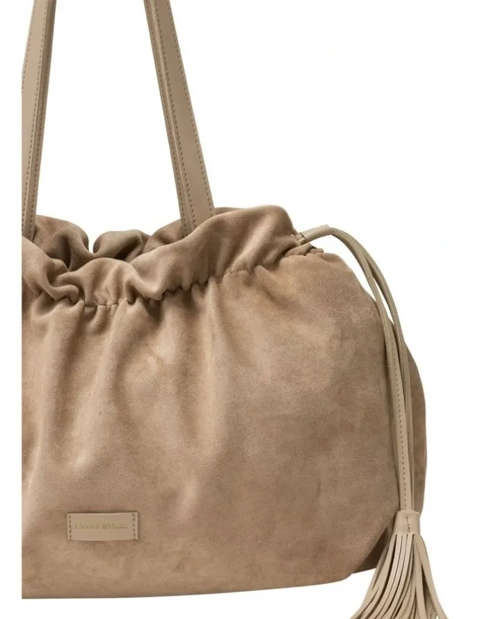 Every Other DRAWSTRING TASSLE SHOULDER BAG IN SAND FAUX SUEDE