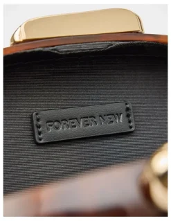 Forever New Peyton Oval Hardcase Clutch in Brown