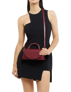 Olga Berg Phoebe Bamboo Top Handle Bag in Burgundy