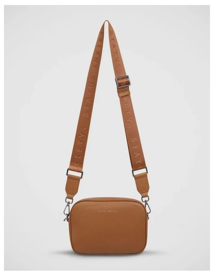 Status Anxiety Plunder Crossbody Bag with Dual Straps in Camel