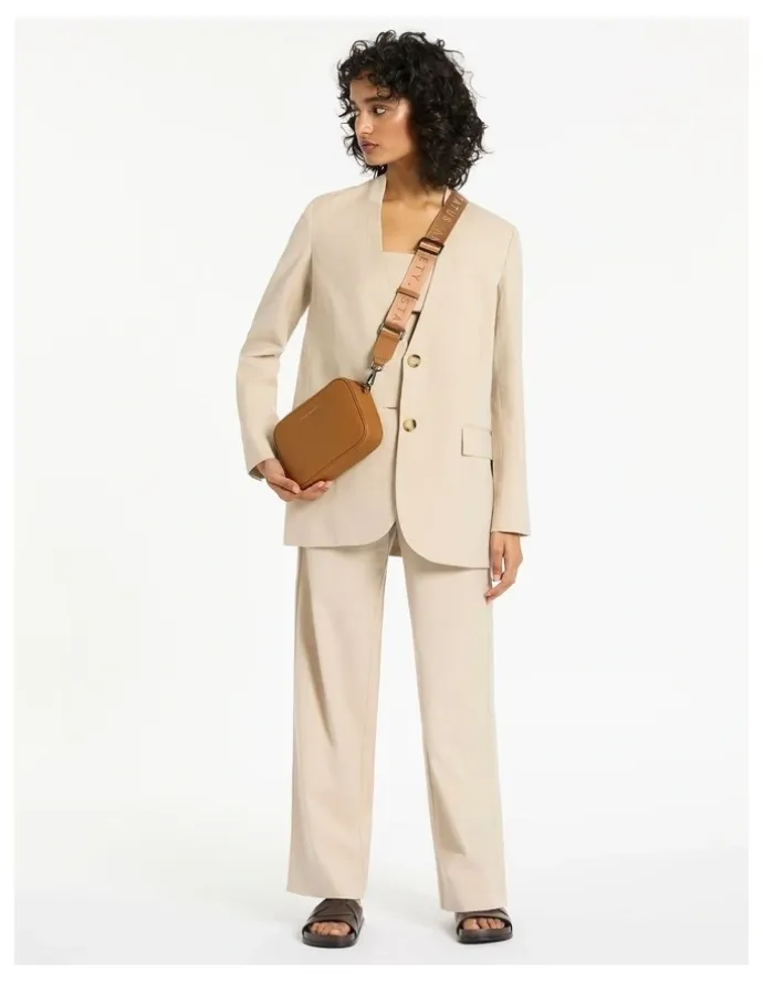Status Anxiety Plunder Crossbody Bag with Dual Straps in Camel