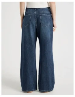 There After Mid Rise Distressed Wide Leg Jeans in Mid Blue