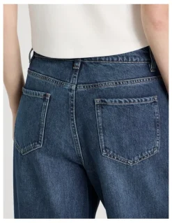 There After Mid Rise Distressed Wide Leg Jeans in Mid Blue