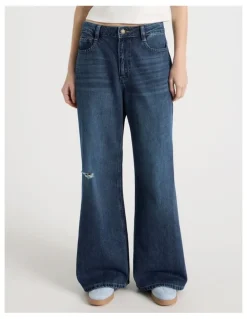There After Mid Rise Distressed Wide Leg Jeans in Mid Blue